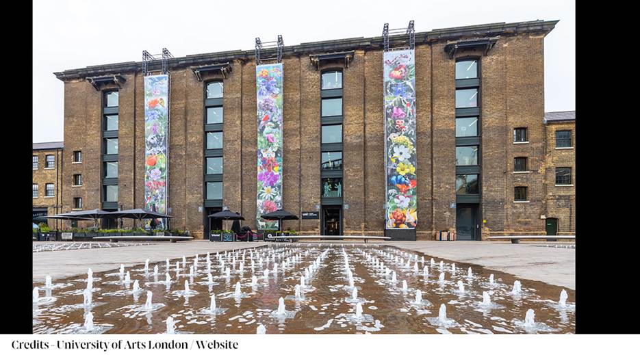 A building with a fountain in front of it

Description automatically generated